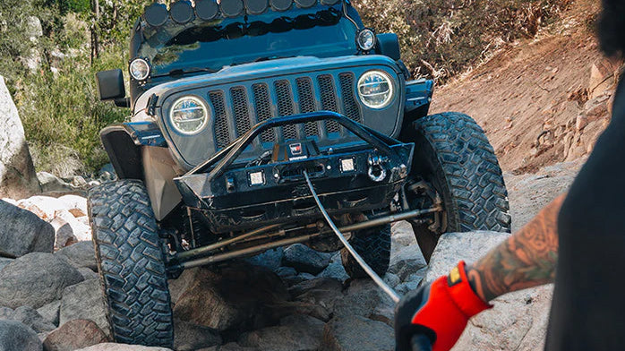 Jeep using Warrior Winch to winch over rocks