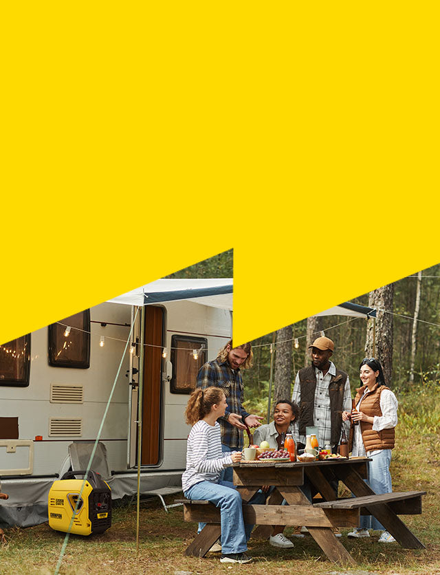 Group of people sitting at a picnic table in front of a camper van with a yellow overlay.
