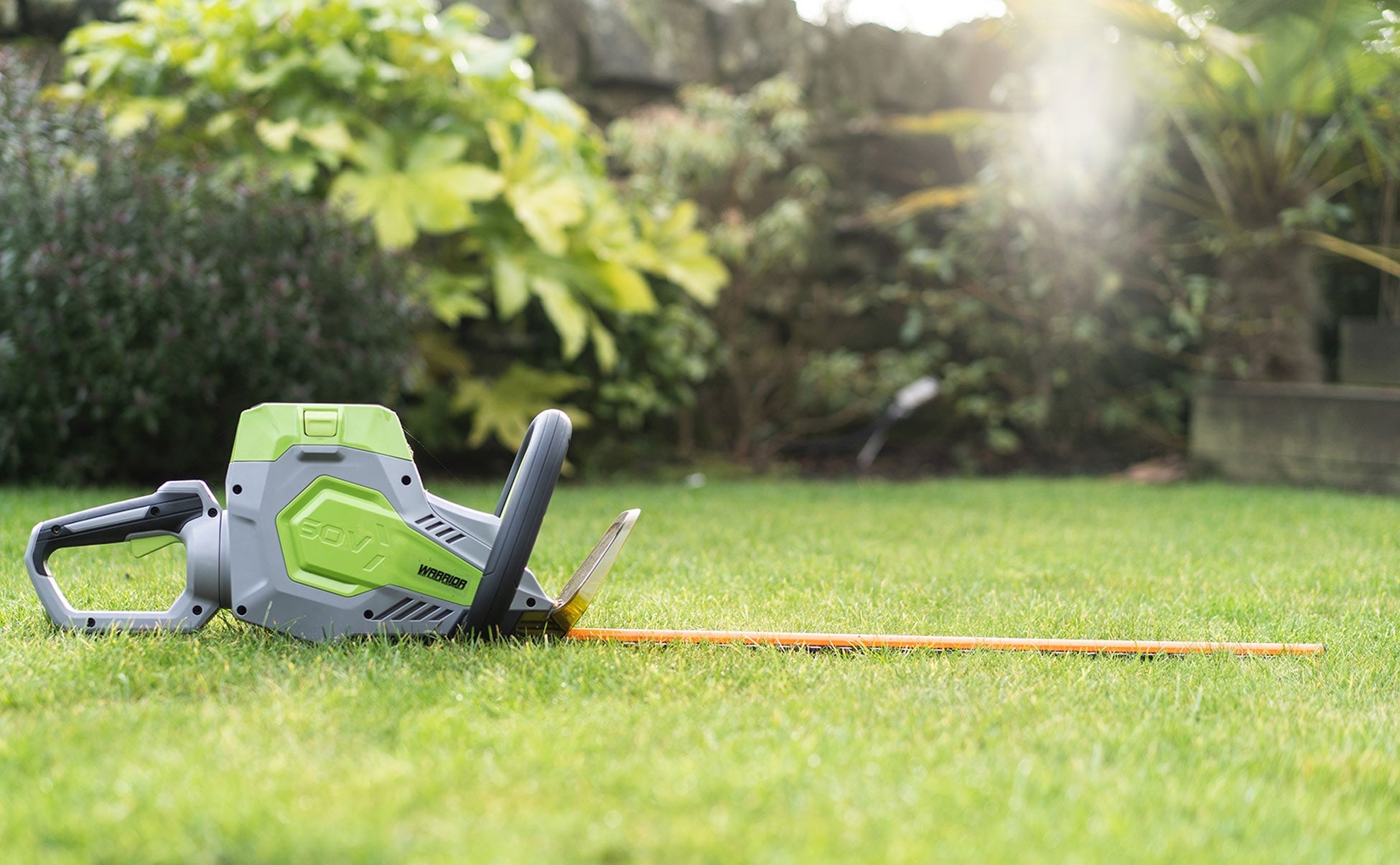 Imagine the Warrior Eco 61cm Cordless Hedge Trimmer in your garden