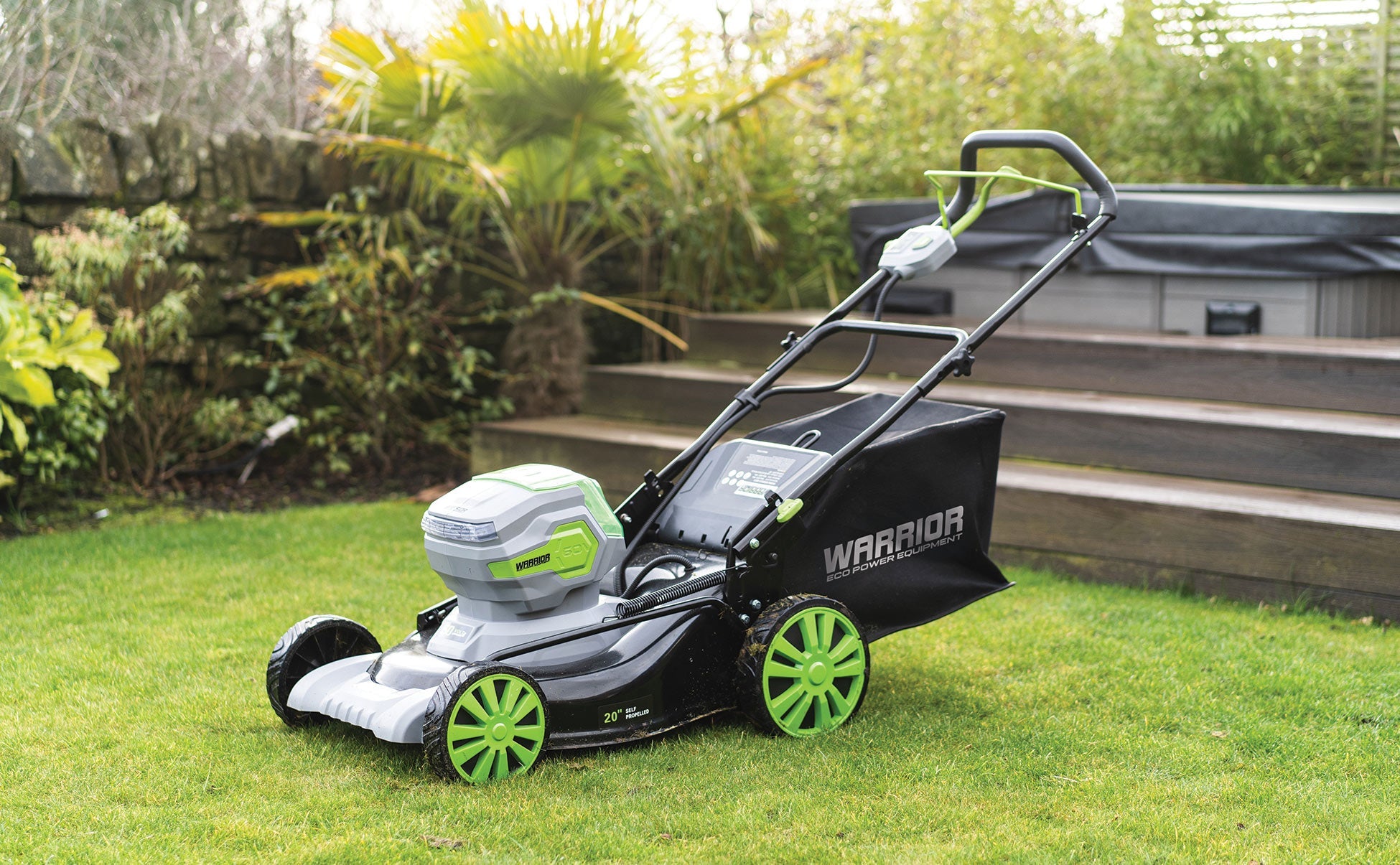 Cordless 50cm Self Propelled Lawn Mower in use mowing lawn